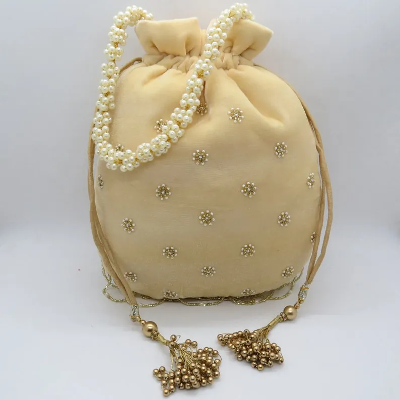 Beautiful Cream embroidered Potli - Rent