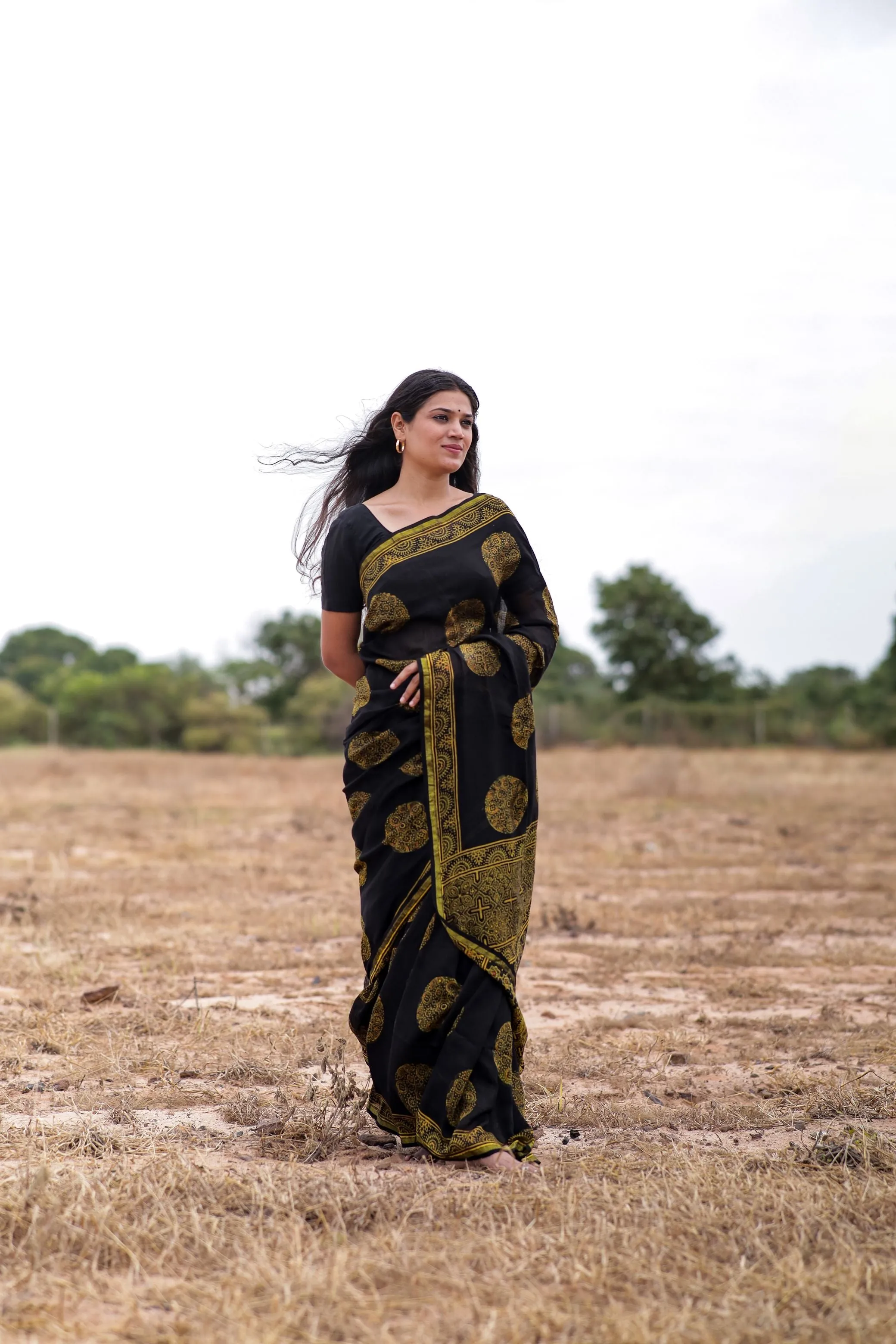 Jharokha -Black and green floral silk cotton Ajrakh handblockprinted saree